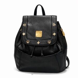 MCM Black Leather Backpack with Gold Hardware and Flap-Top Closure